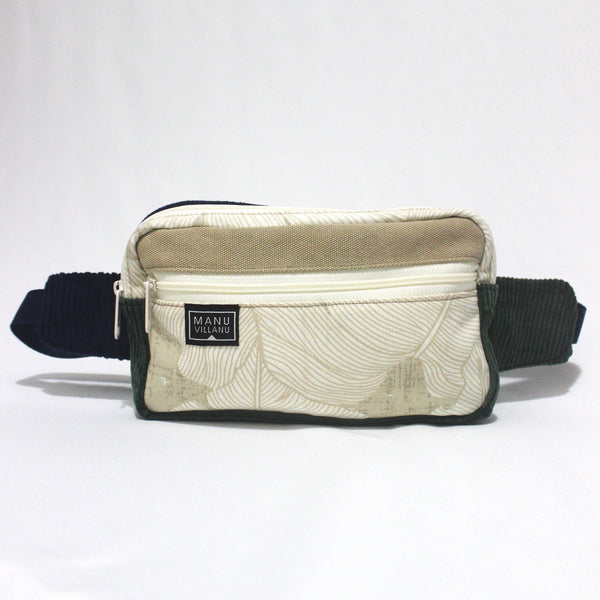 Fanny pack with black waist strap and beige front panel on a white background