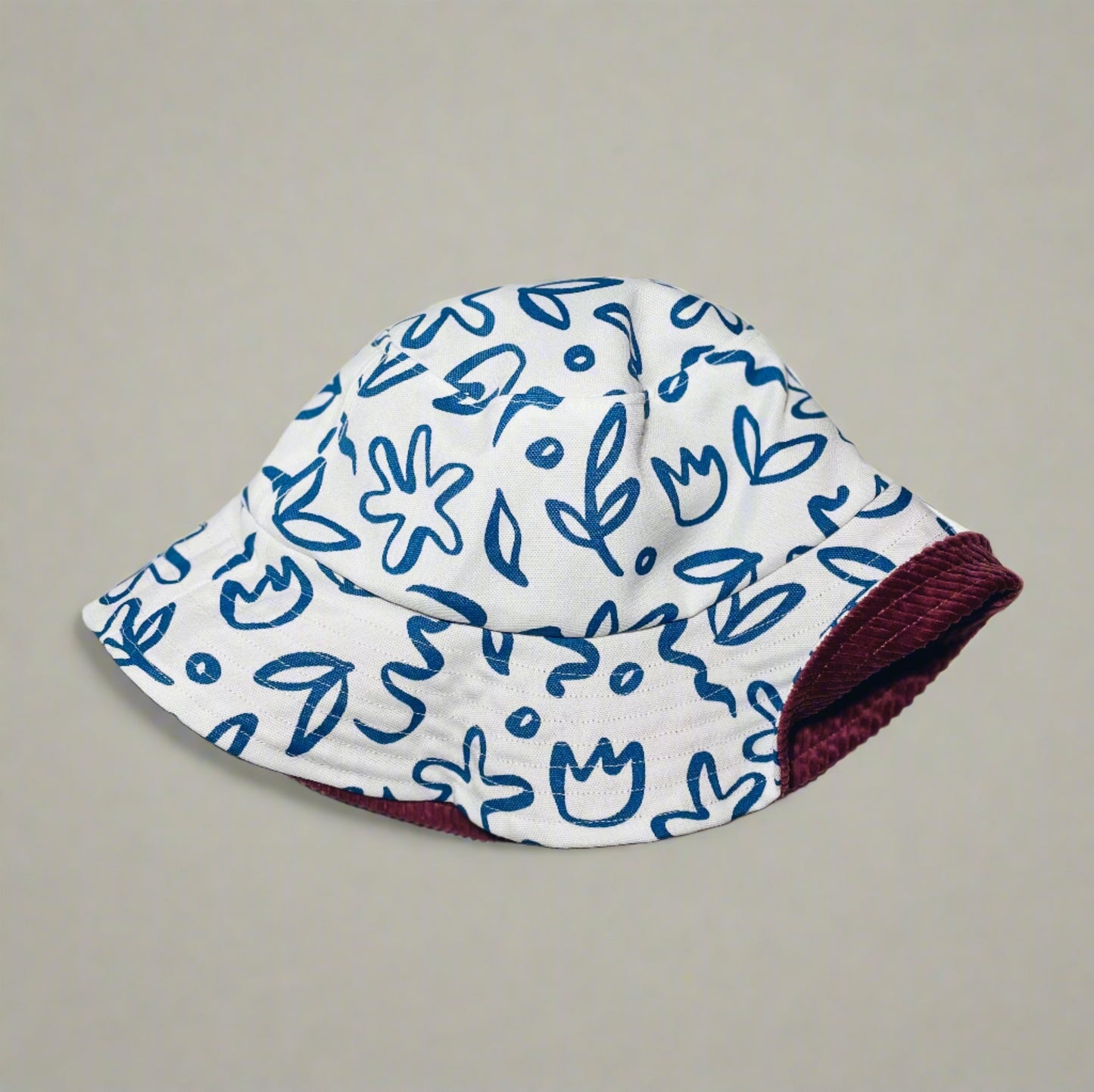 White Floral & Ash Rose Corduroy Reversible Bucket Hat